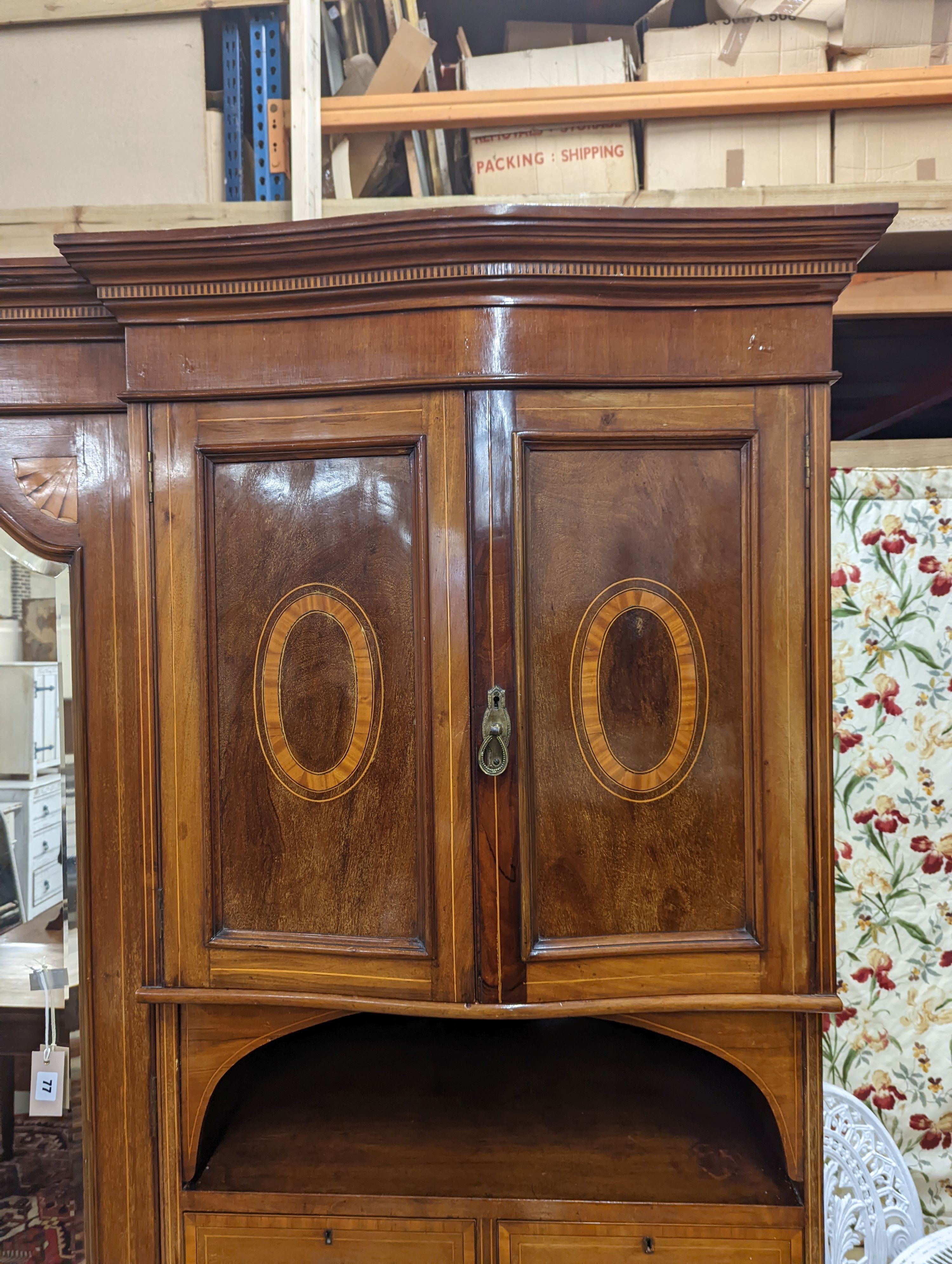 An Edwardian satinwood banded mahogany compactum wardrobe, length 136cm, depth 56cm, height 210cm